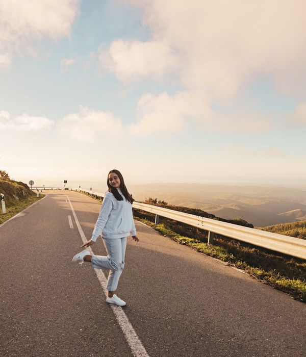 Woman feeling energetic and happy outdoors in nature.